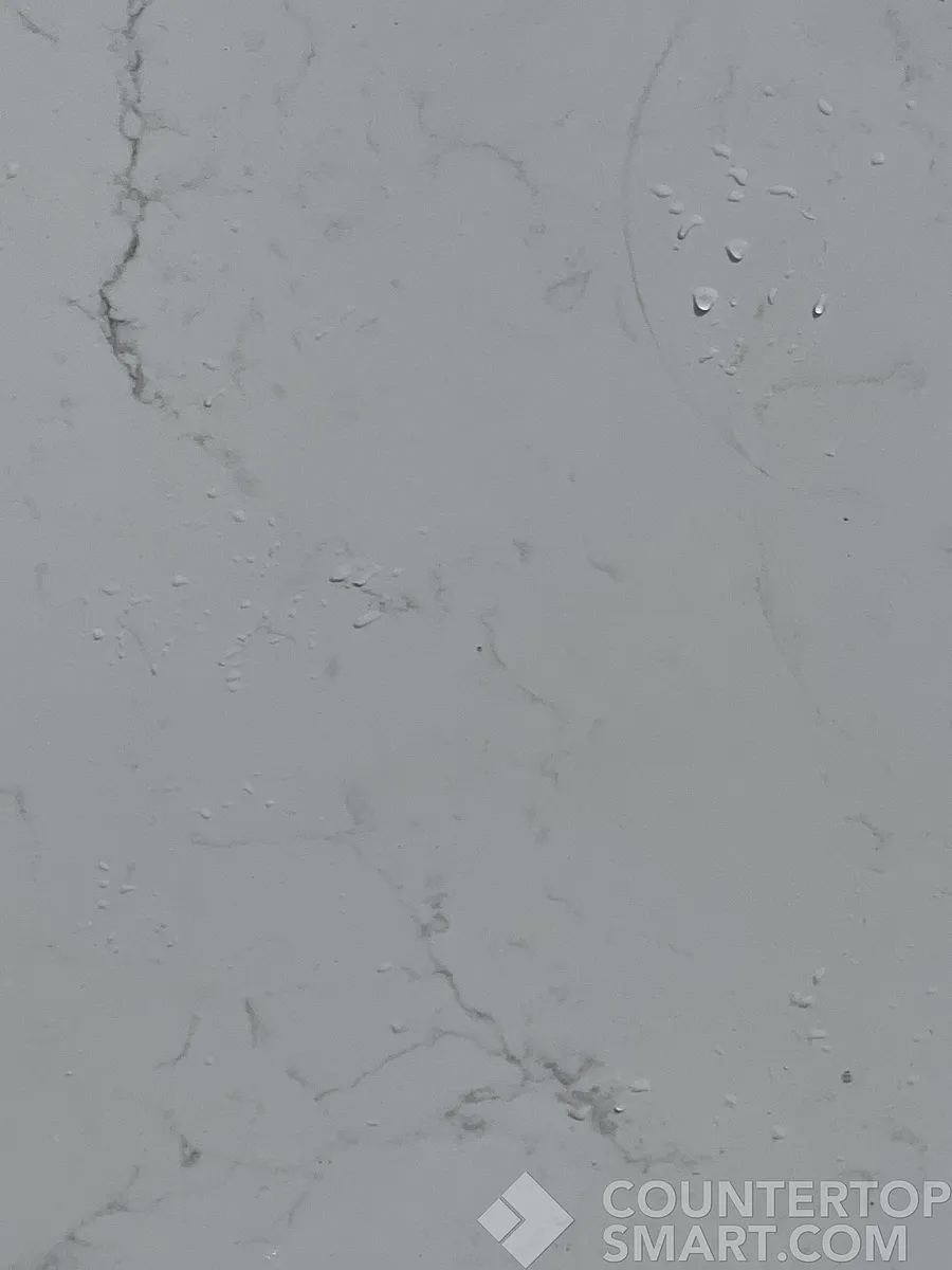 Closeup image of Arizona Tile Bianco Pearl Cream Quartz countertop slab