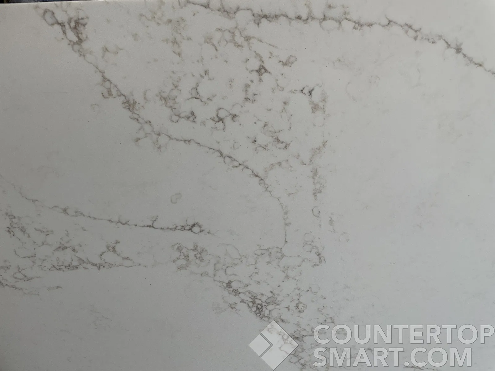 Closeup image of Stratus Quartz Statuario Gold Quartz countertop slab
