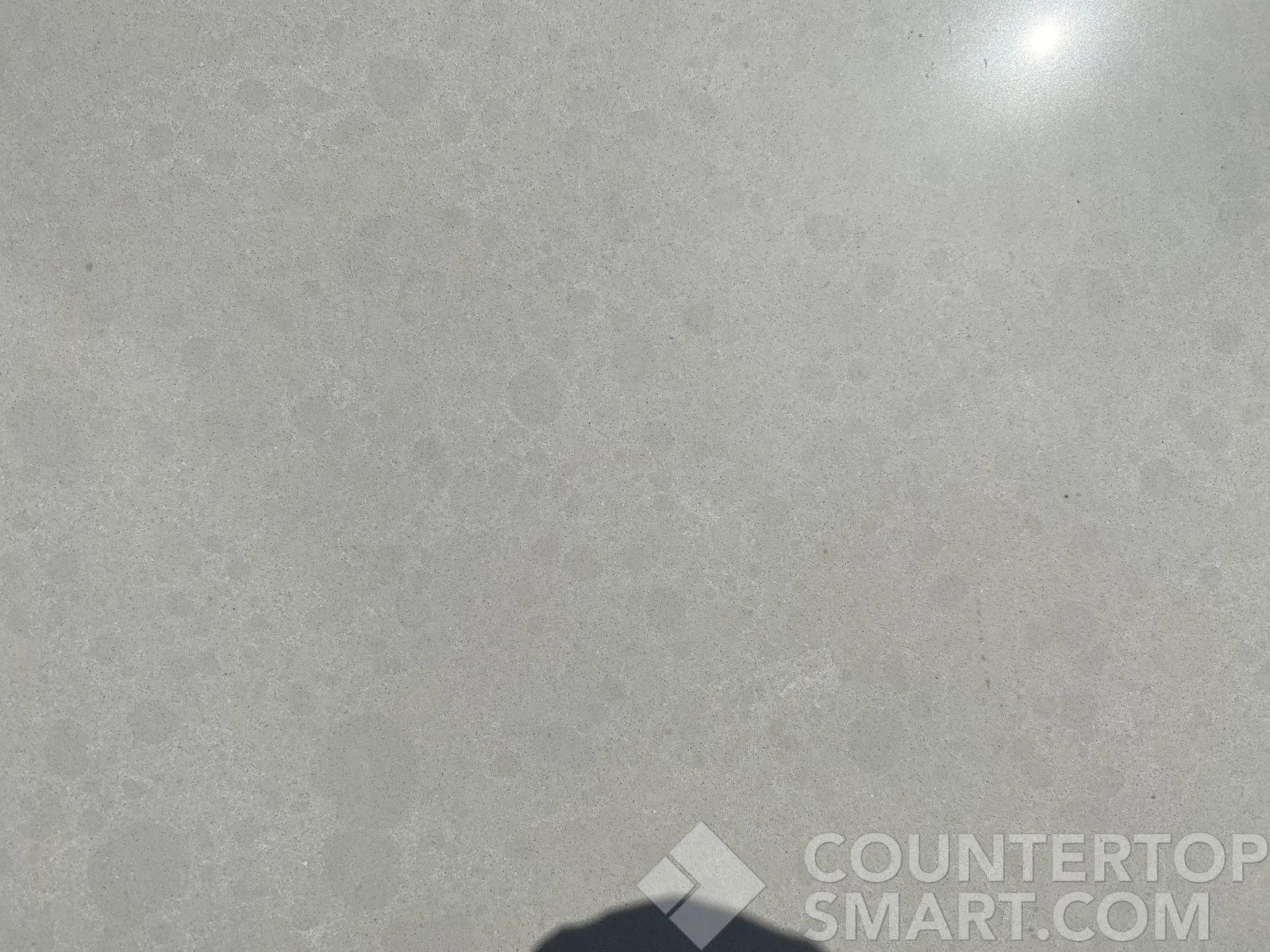 Closeup image of Q Quartz Calico White Quartz countertop slab