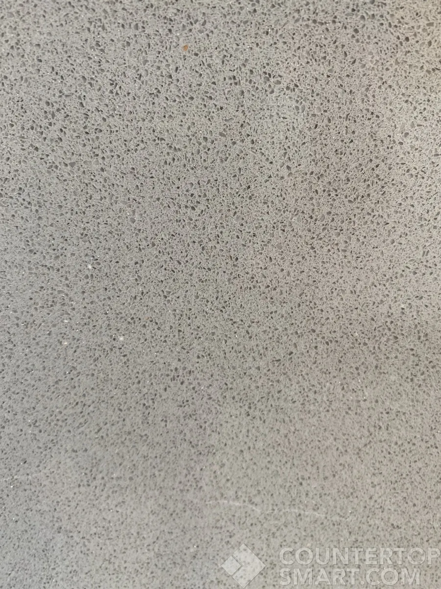 Closeup image of Daltile Brushed Flannel Grey Quartz countertop slab