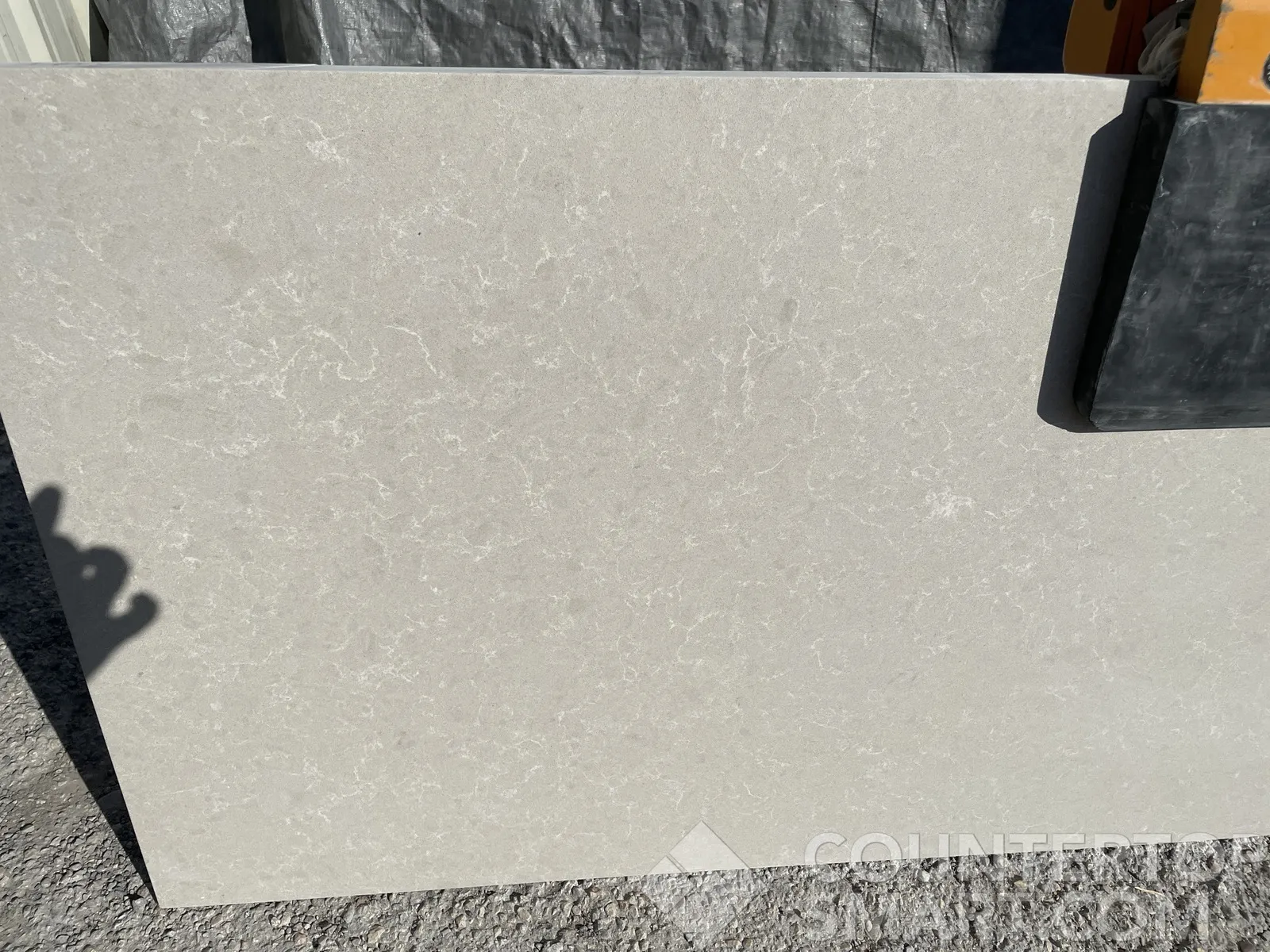Closeup image of Della Terra Ivory White Quartz countertop slab