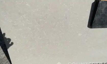 Closeup image of Della Terra Ivory White Quartz countertop slab