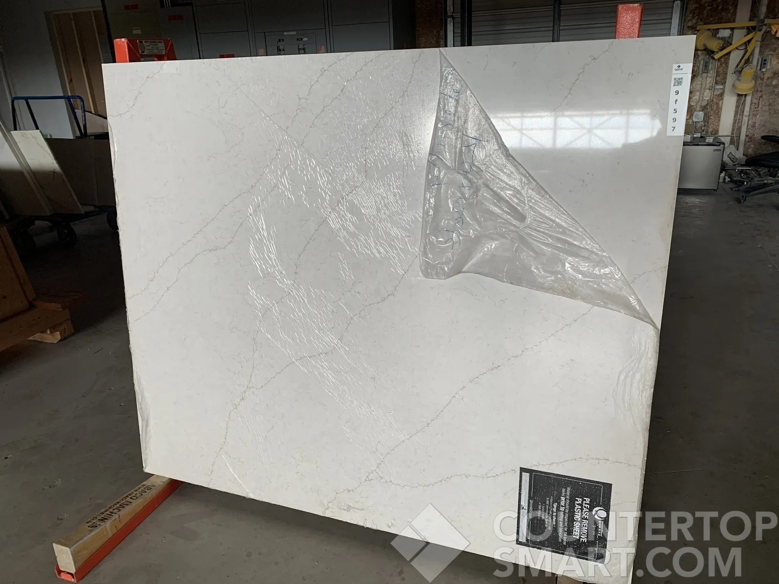 Full image of Q Quartz Calacatta Karmelo Quartz countertop slab