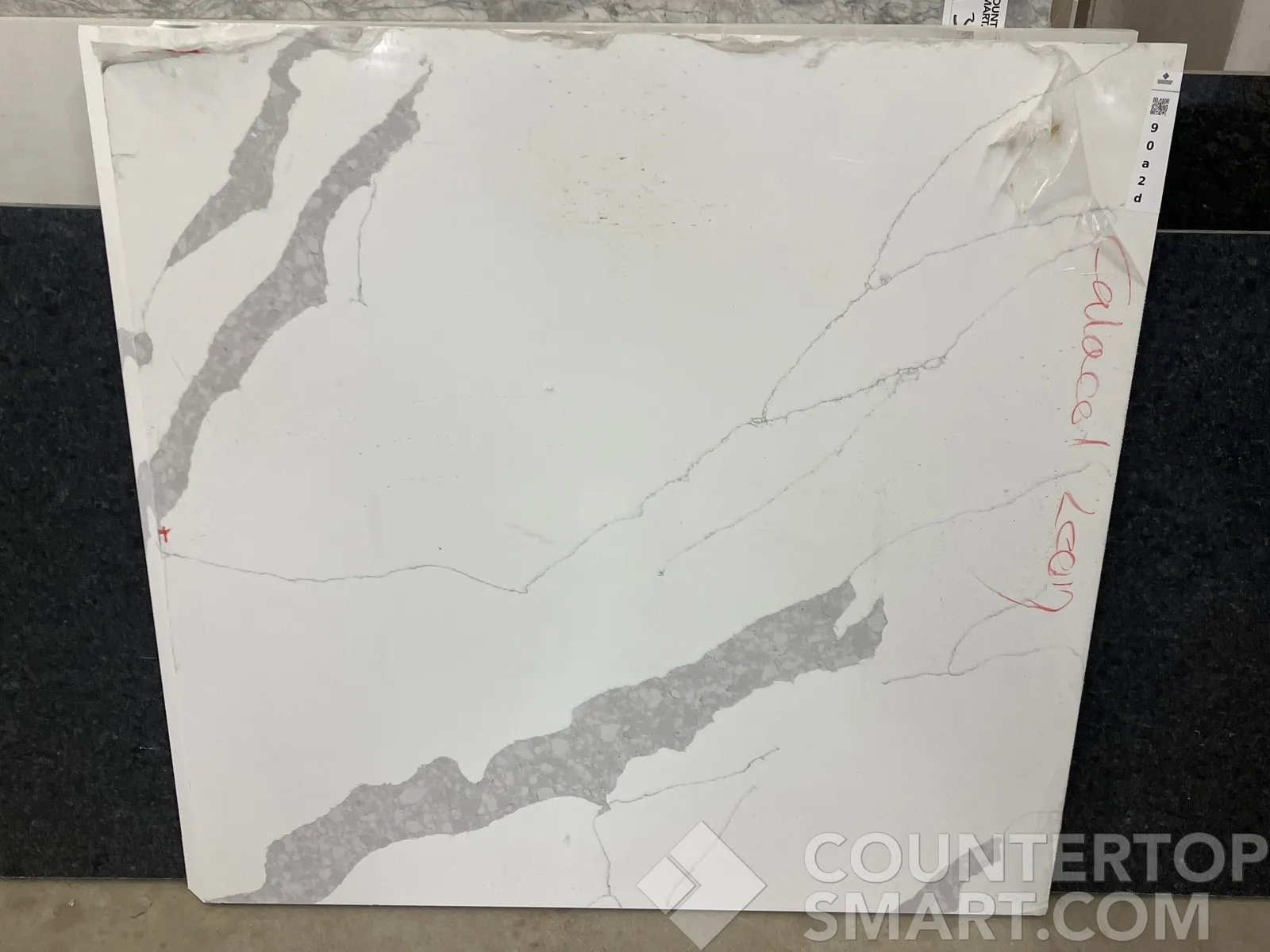 Full image of Q Quartz Calacatta Leon Quartz countertop slab