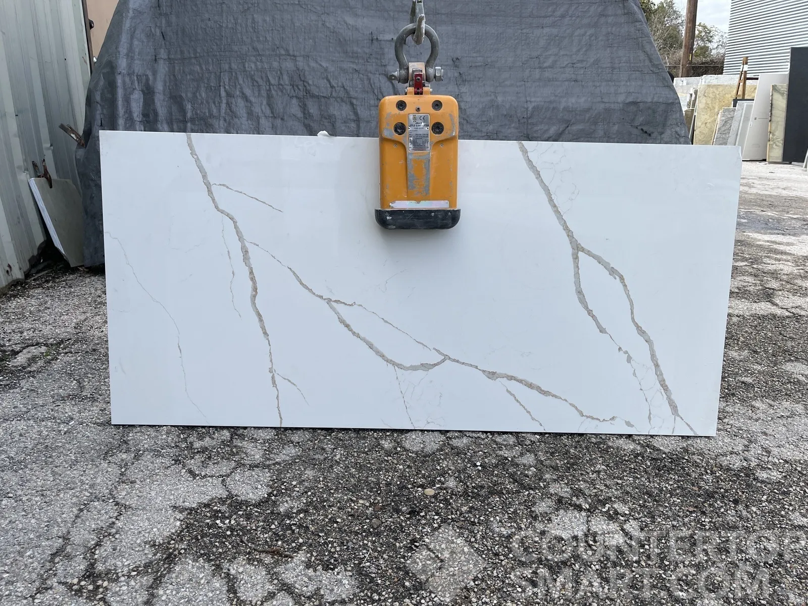 Full image of Q Quartz Calacatta Laza Quartz countertop slab