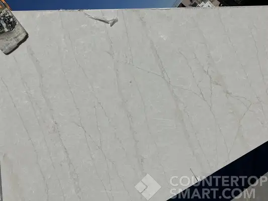 Full image of Q Quartz Calacatta Taj Quartz countertop slab