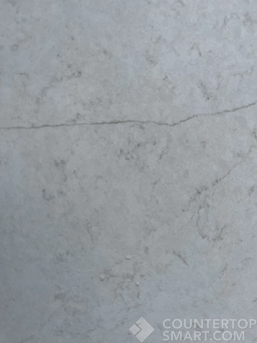 Closeup image of Daltile Freedom Calacatta Quartz countertop slab
