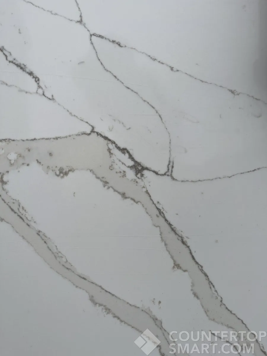 Closeup image of Compac Unique Calacatta Gold Quartz countertop slab