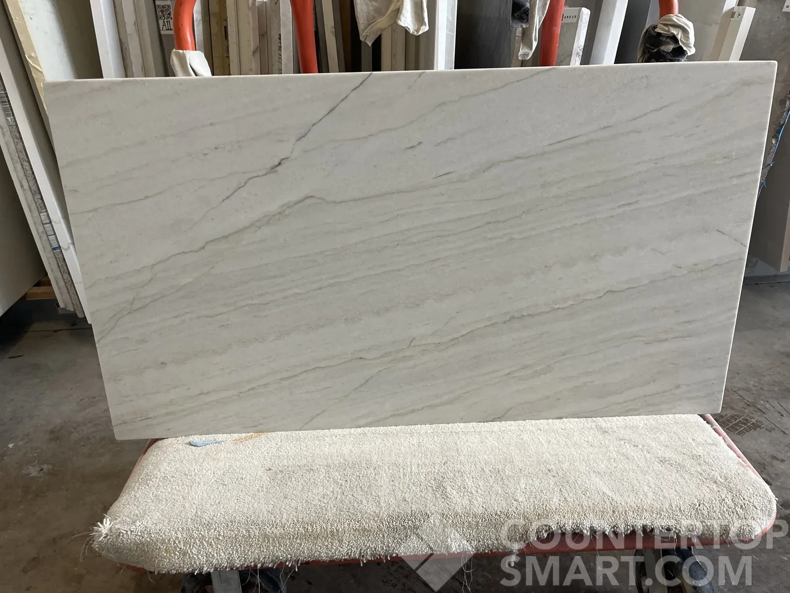 Closeup image of Ivory Macaubas White Quartzite countertop slab