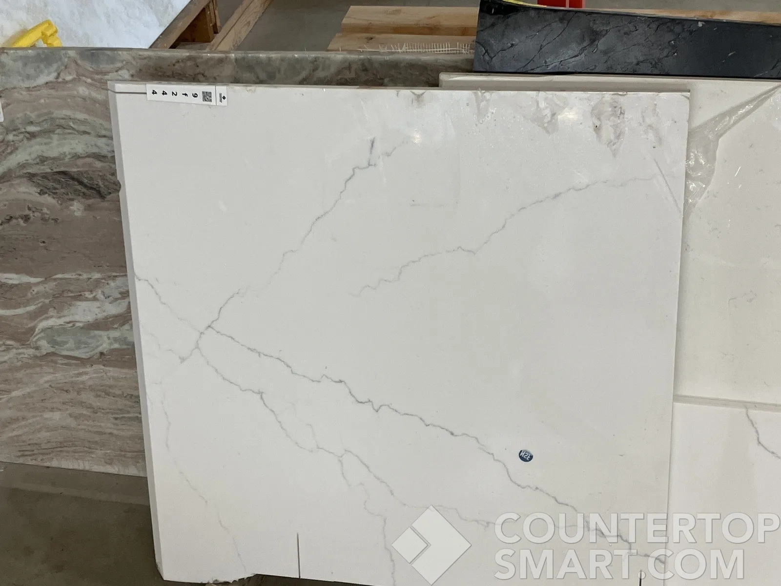 Full image of Q Quartz Calacatta Miraggio Quartz countertop slab