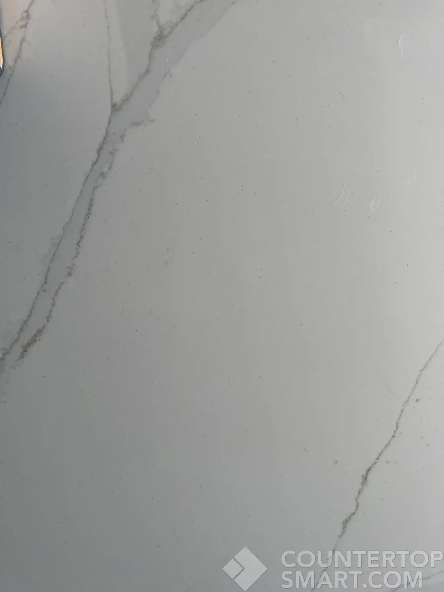 Closeup image of Compac Unique Calacatta Gold Quartz countertop slab