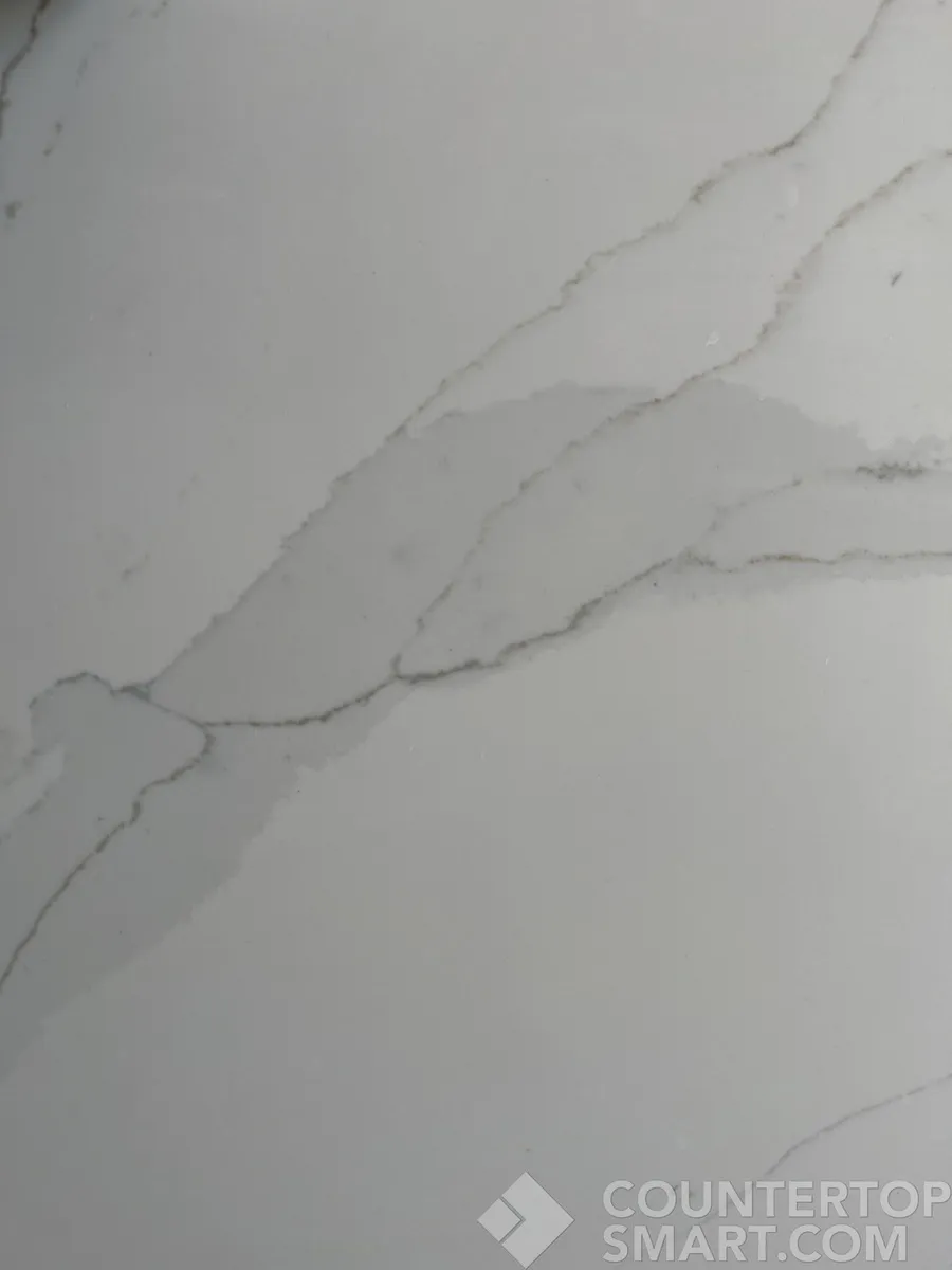Closeup image of Compac Unique Calacatta Gold Quartz countertop slab