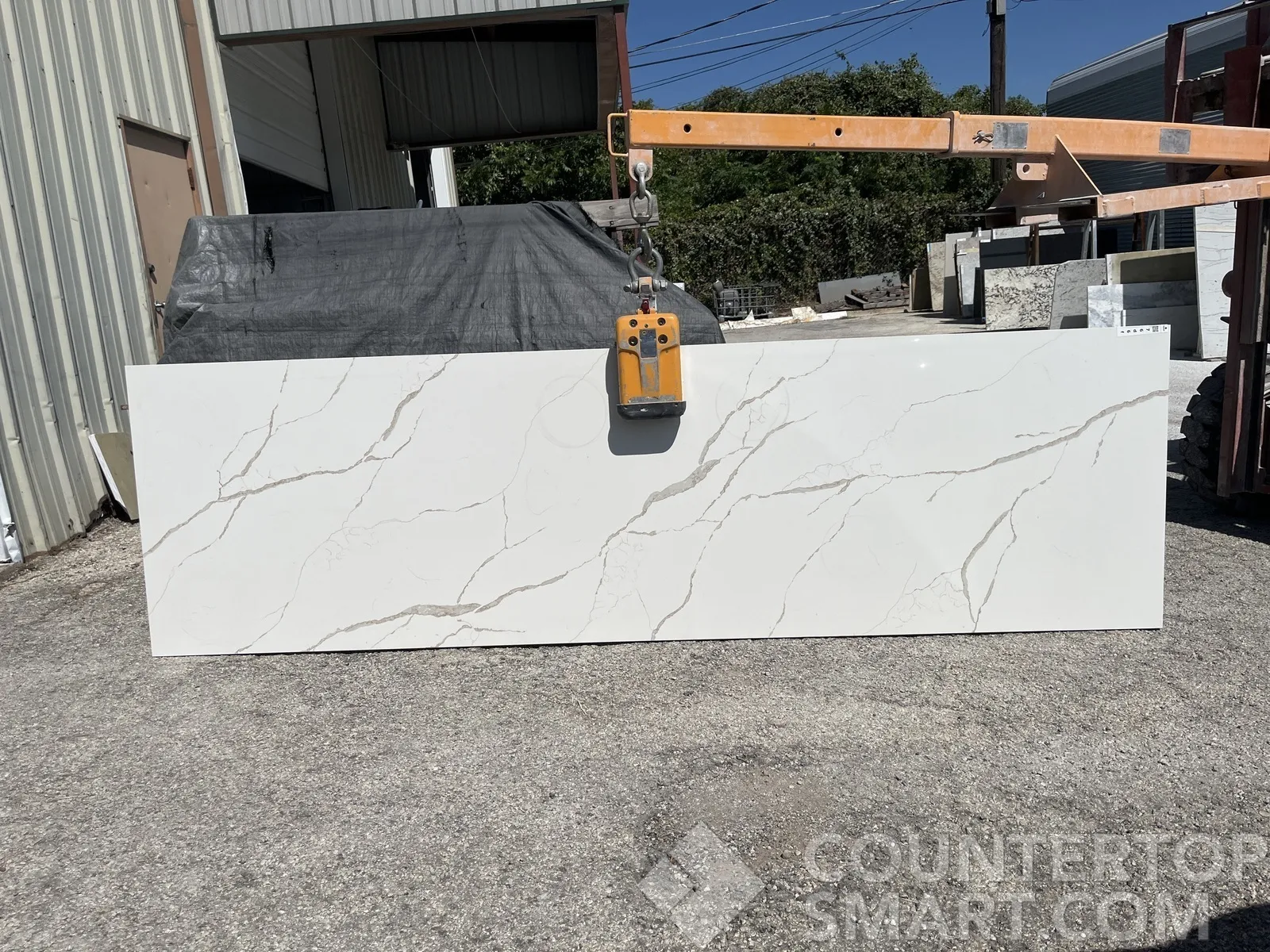 Full image of Q Quartz Calacatta Laza Quartz countertop slab
