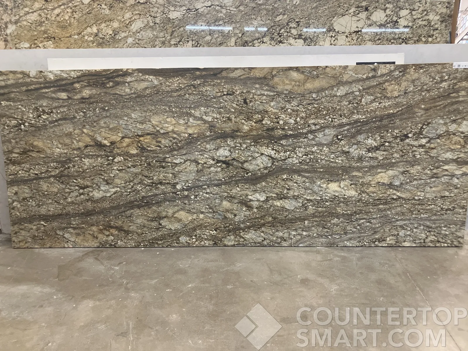 Full image of Blue Dunes (Thunder Mountain) Brown Granite countertop slab