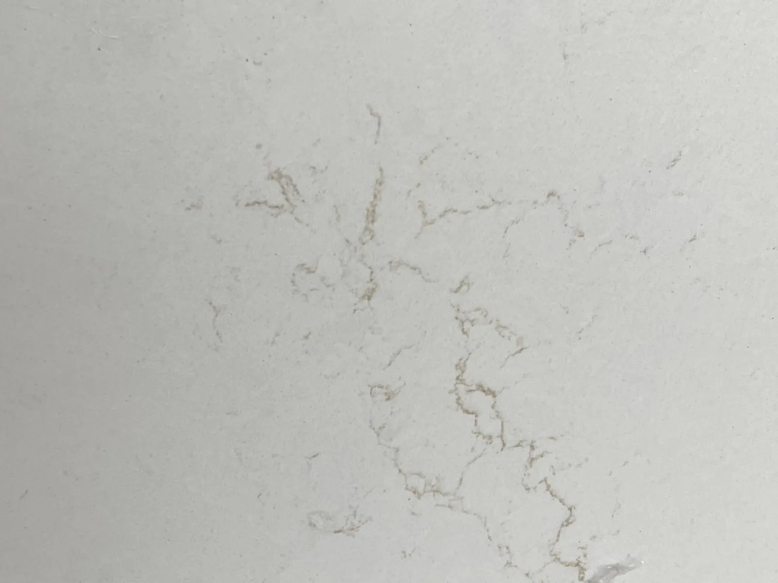 Closeup image of Daltile Freedom Calacatta Quartz countertop slab