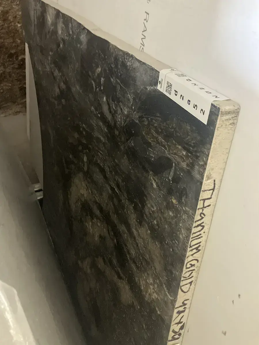 Full image of Titanium Gold Black Granite countertop slab