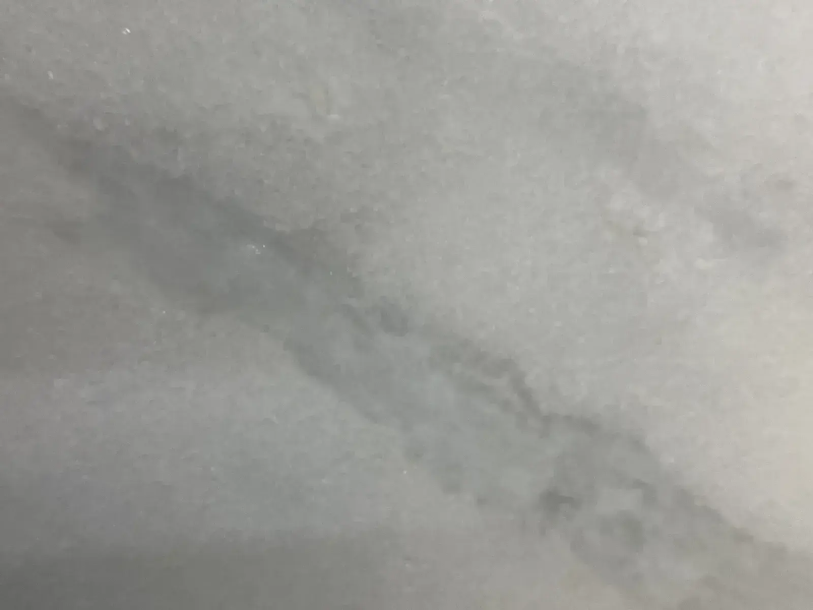 Closeup image of Shadow Storm White Marble countertop slab