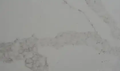 Closeup image of Stratus Quartz Calacatta Lumiere White Quartz countertop slab