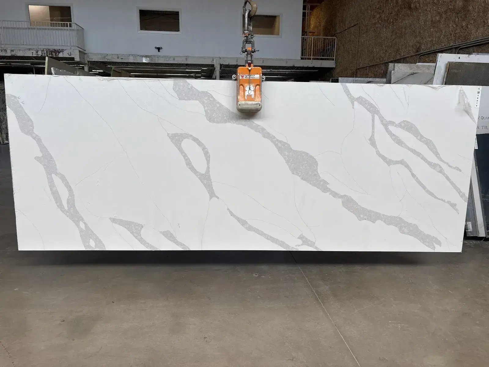 Full image of Q Quartz Calacatta Leon Quartz countertop slab