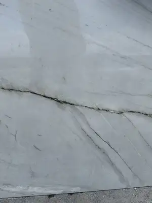 Closeup image of Calacatta Boheme White Quartzite countertop slab