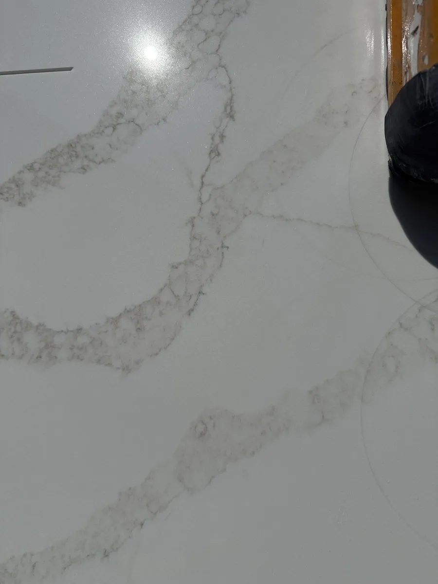 Closeup image of Stratus Quartz Calacatta Lumiere White Quartz countertop slab