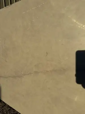 Closeup image of Q Quartz Solitaj Cream Quartz countertop slab