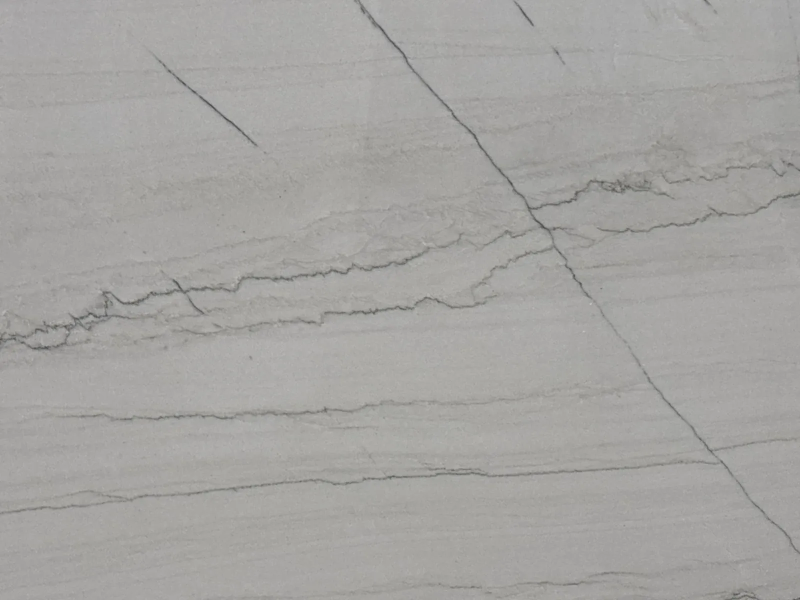 Closeup image of Statuario Quartzite countertop slab