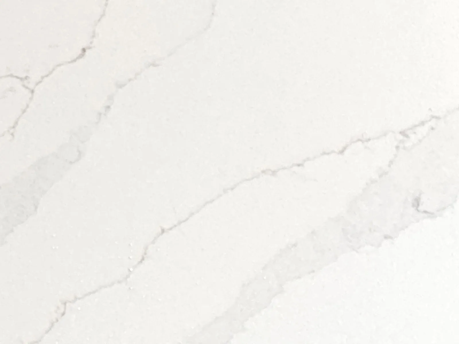 Closeup image of Della Terra Ridge White Quartz countertop slab