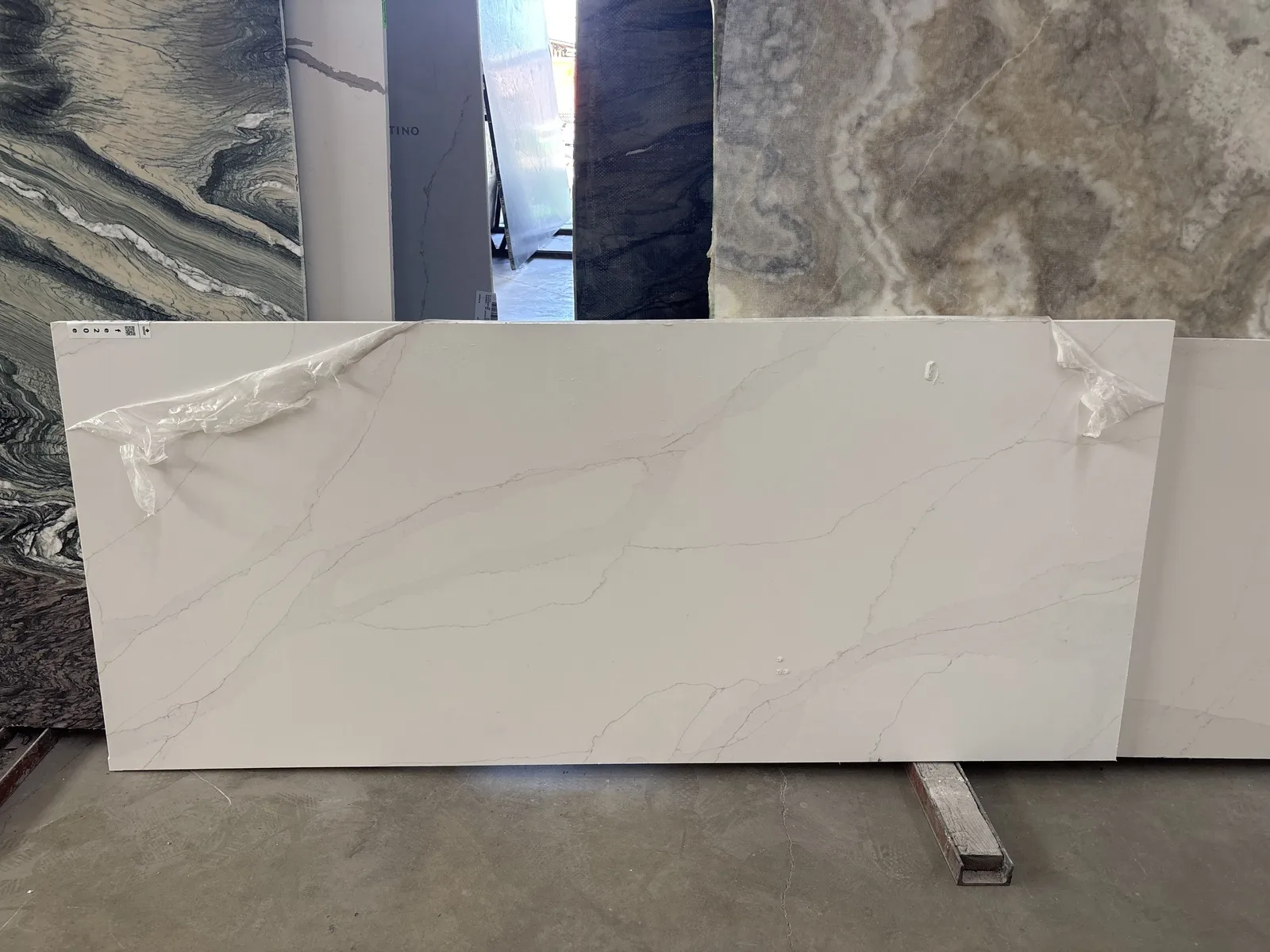Full image of Q Quartz Calacatta Abezzo Quartz countertop slab