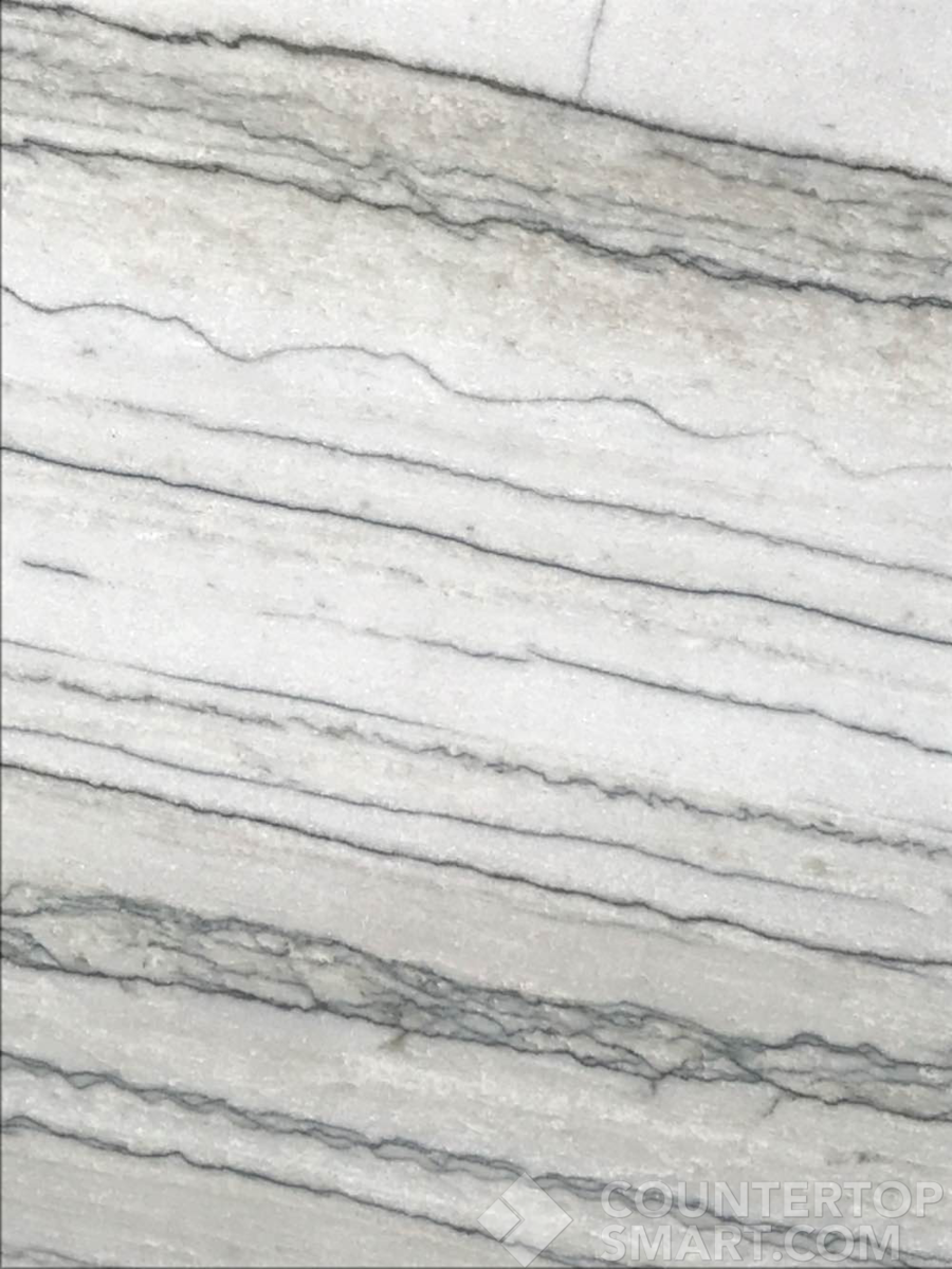 Closeup image of White Macaubas Quartzite countertop slab