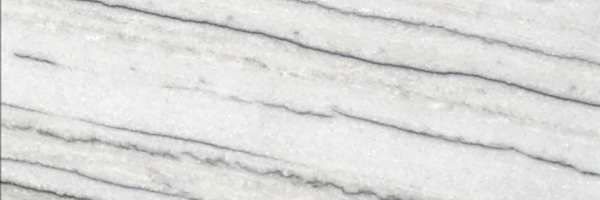Closeup image of White Macaubas Quartzite countertop slab