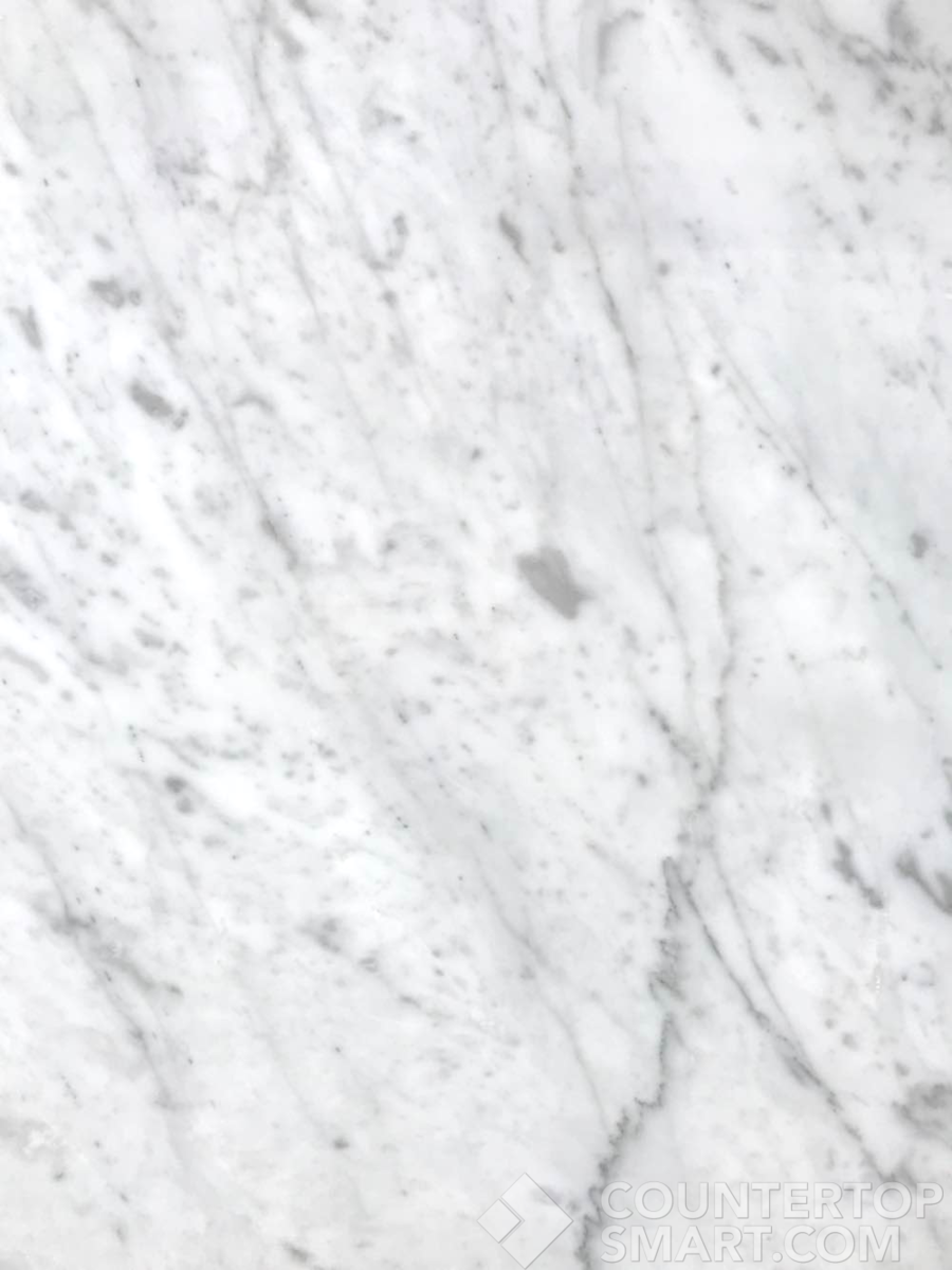 Closeup image of Carrara White Marble countertop slab