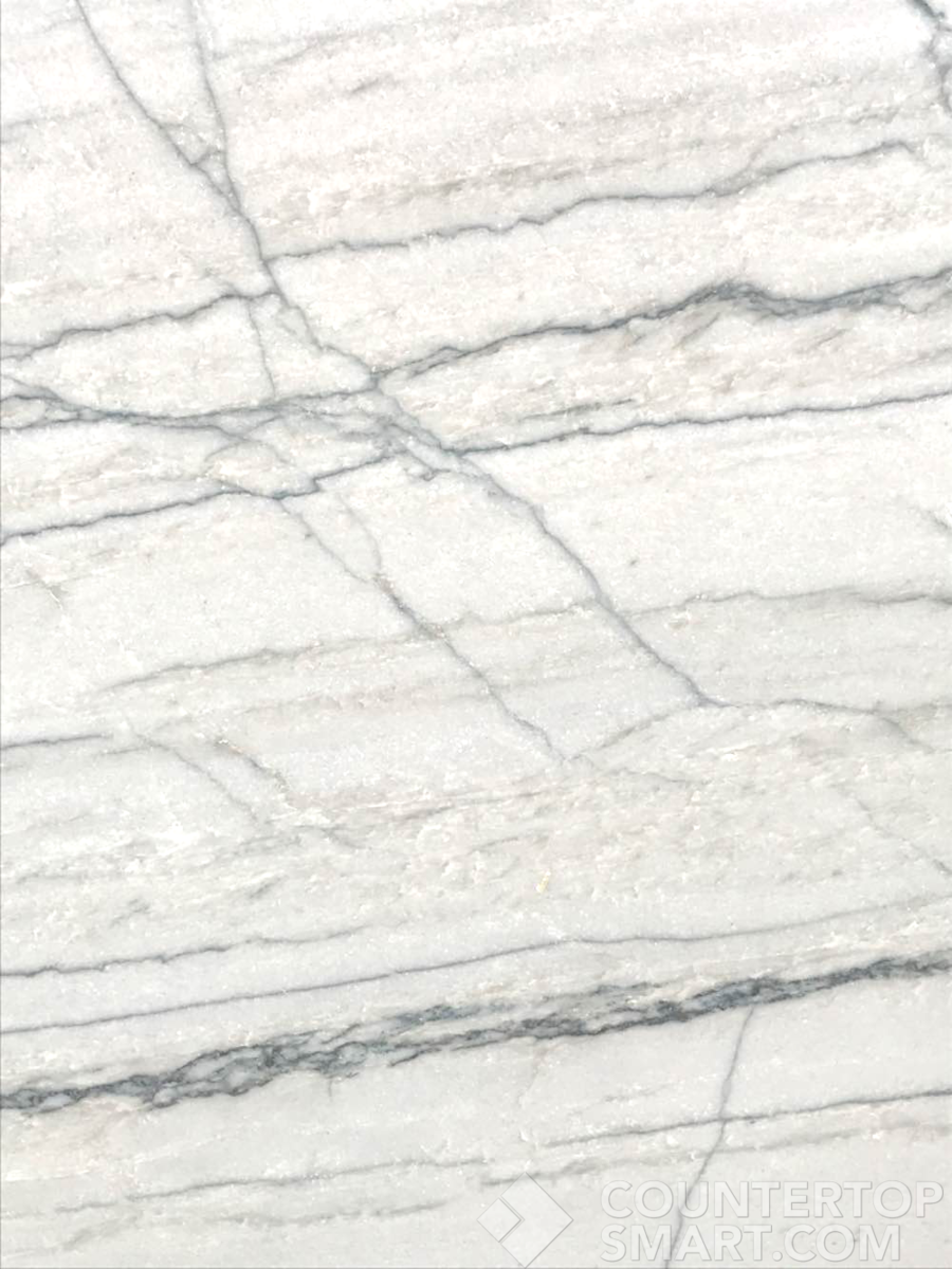Closeup image of White Macaubas Quartzite countertop slab
