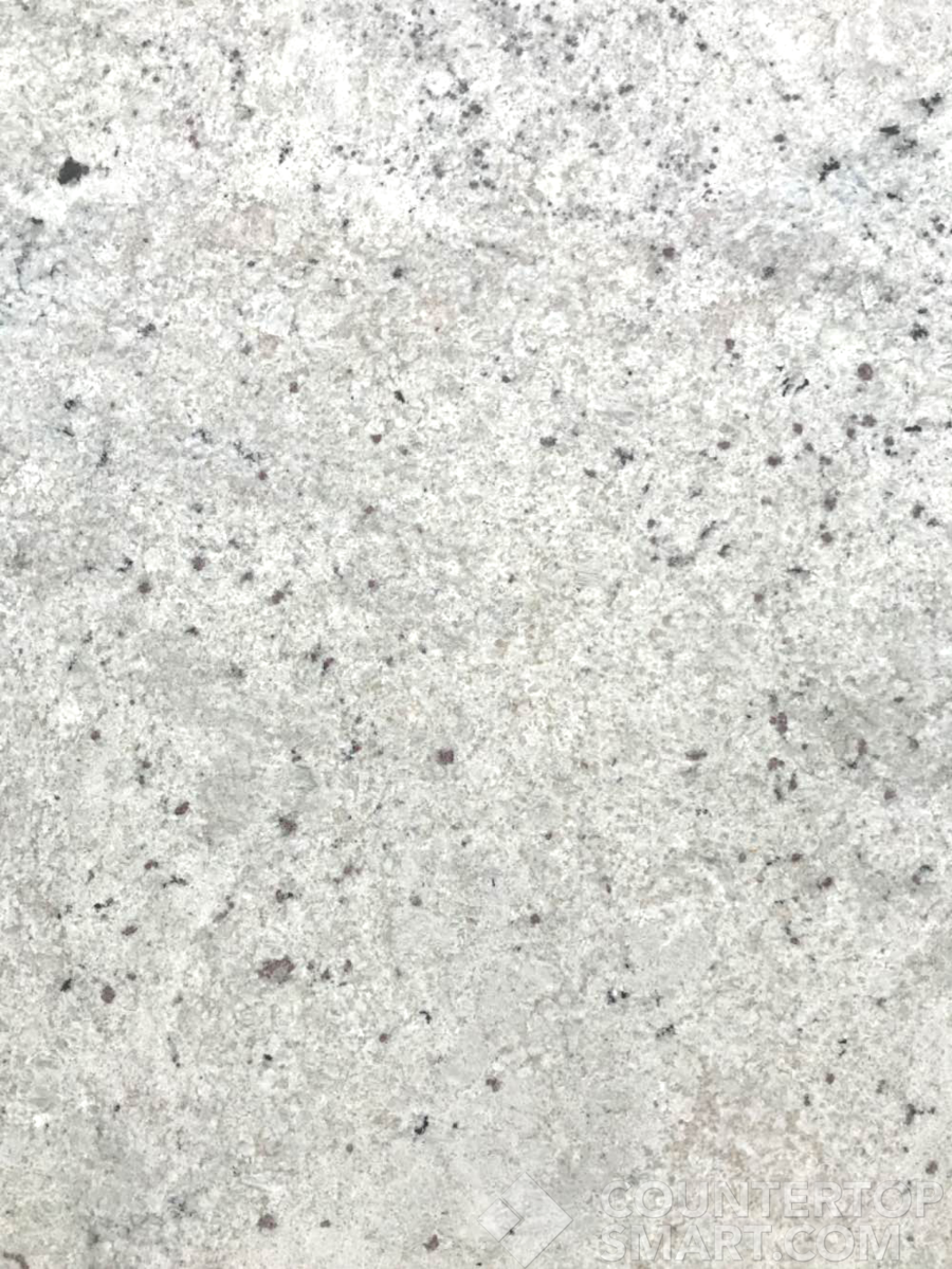Closeup image of Colonial White Cream Granite countertop slab