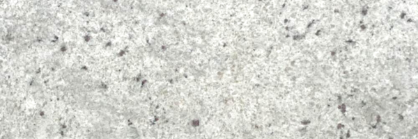 Closeup image of Colonial White Cream Granite countertop slab