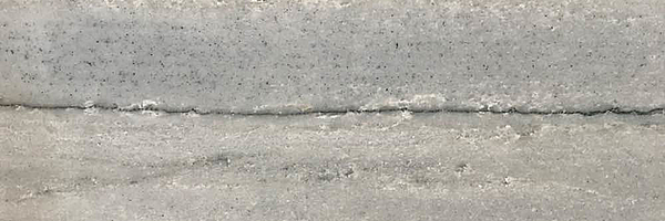 Closeup image of White Macaubas Quartzite countertop slab