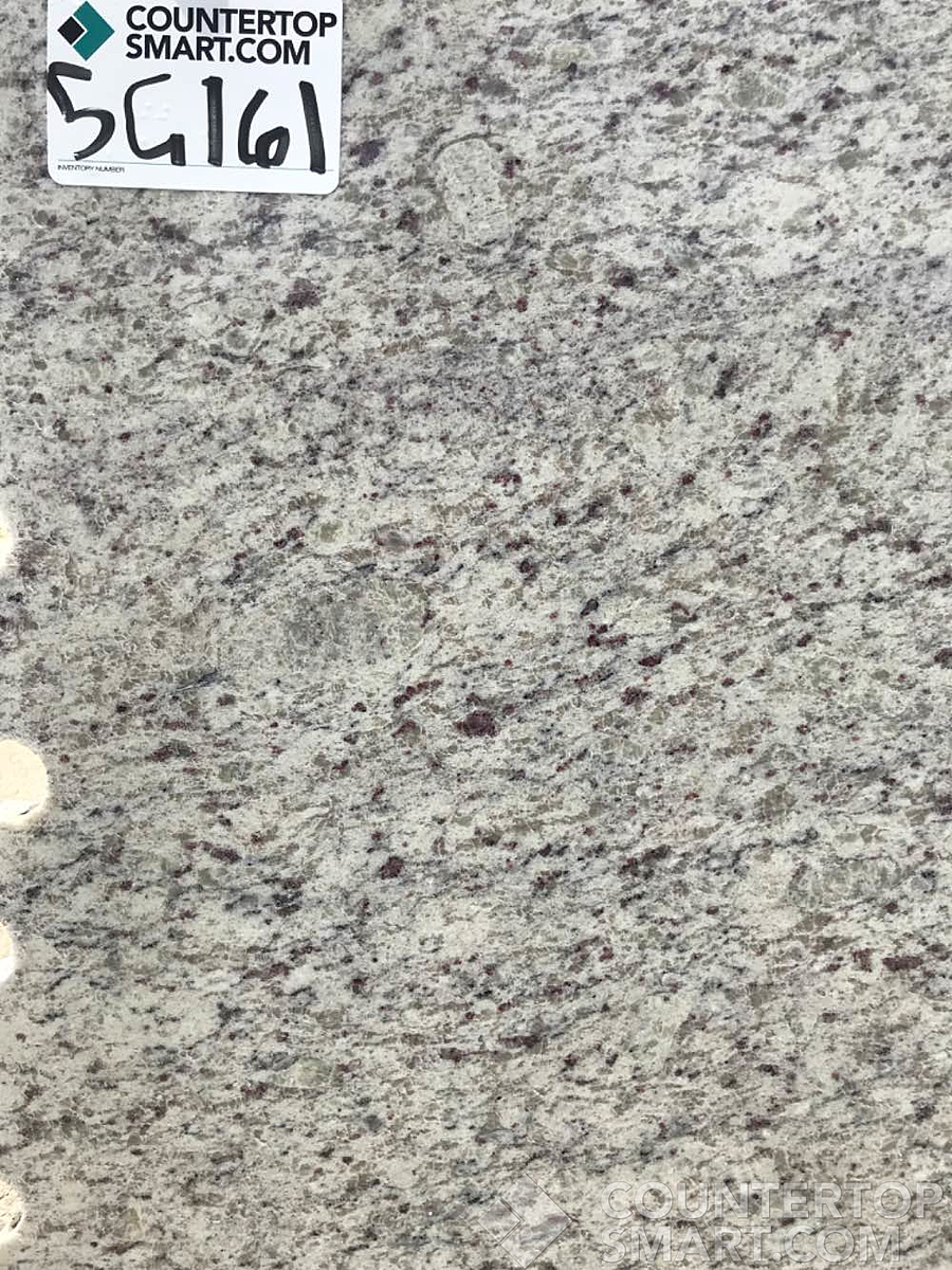 Closeup image of Dallas White Granite countertop slab