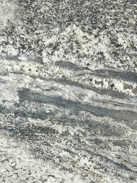Closeup image of Monte Cristo Grey Granite countertop slab