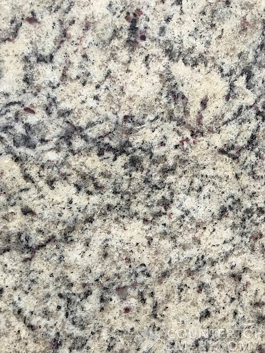 Closeup image of Dallas White Granite countertop slab