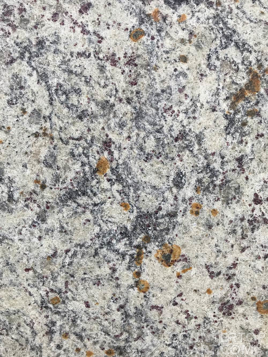 Closeup image of Giallo Fiesta Grey Granite countertop slab
