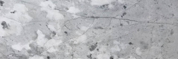Closeup image of Bianco Carrara Marble countertop slab