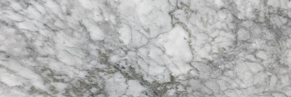 Closeup image of Carrara Marble countertop slab