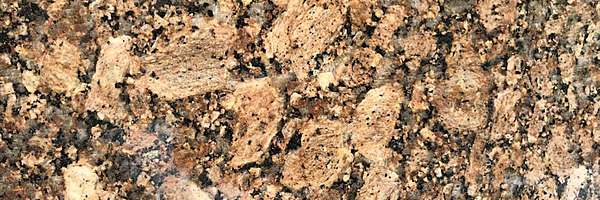Closeup image of Giallo Fiorito Granite countertop slab