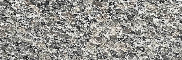 Closeup image of New Caledonia Granite countertop slab
