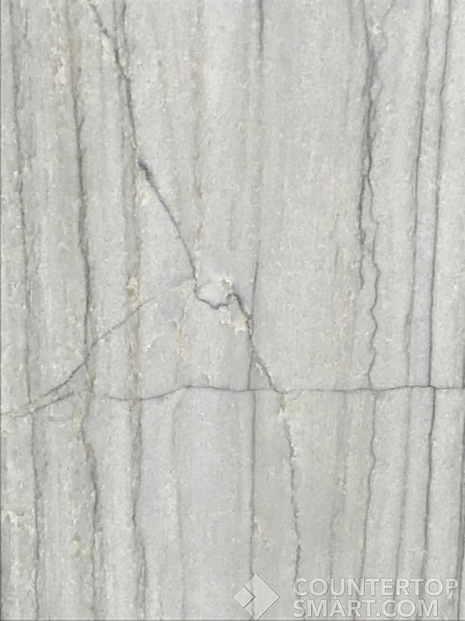 Closeup image of White Macaubas Quartzite countertop slab