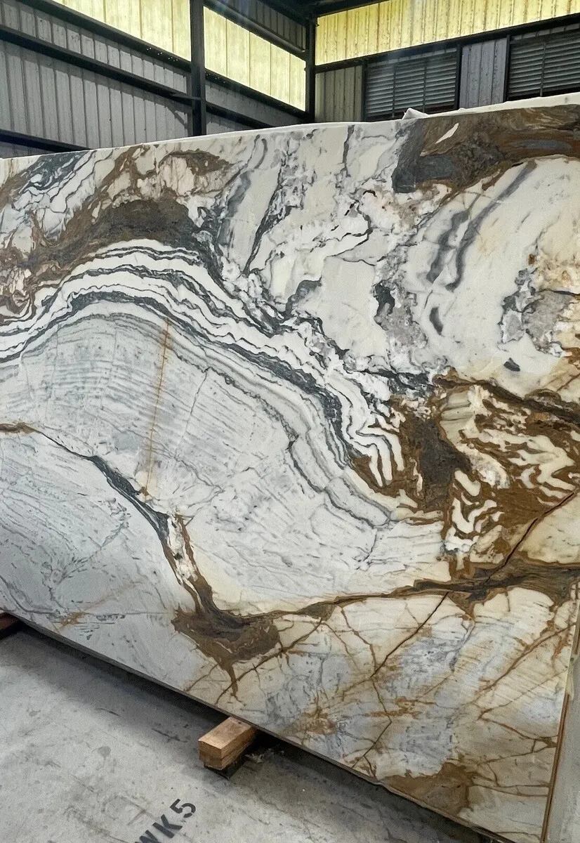 Closeup image of Calacatta Picasso Cream Marble countertop slab