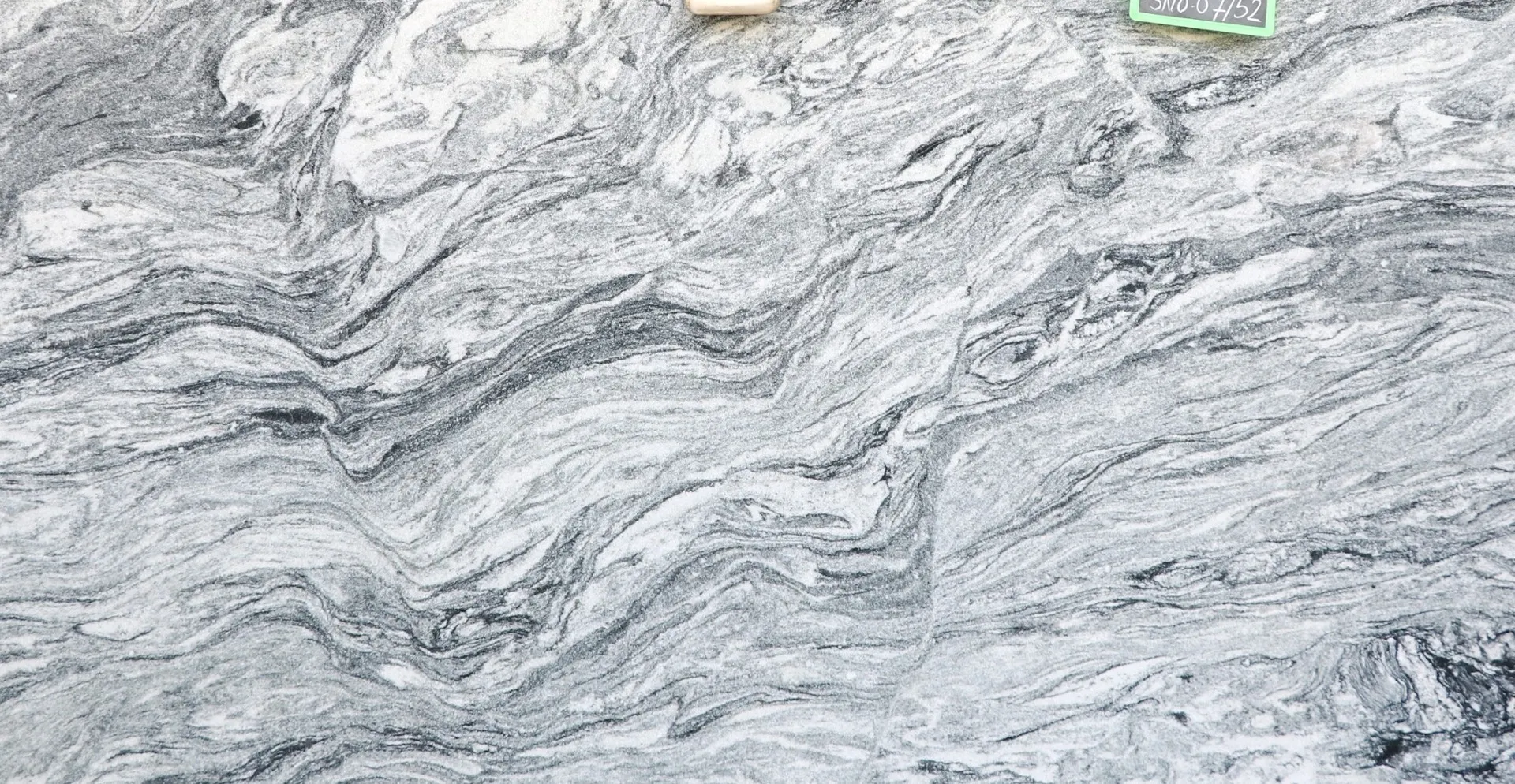 Closeup image of Cloudy White (Viscont White 1st Choice) Grey Granite countertop slab