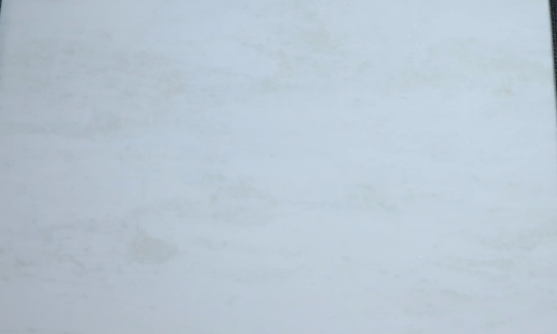 Closeup image of Namibian White White Marble countertop slab