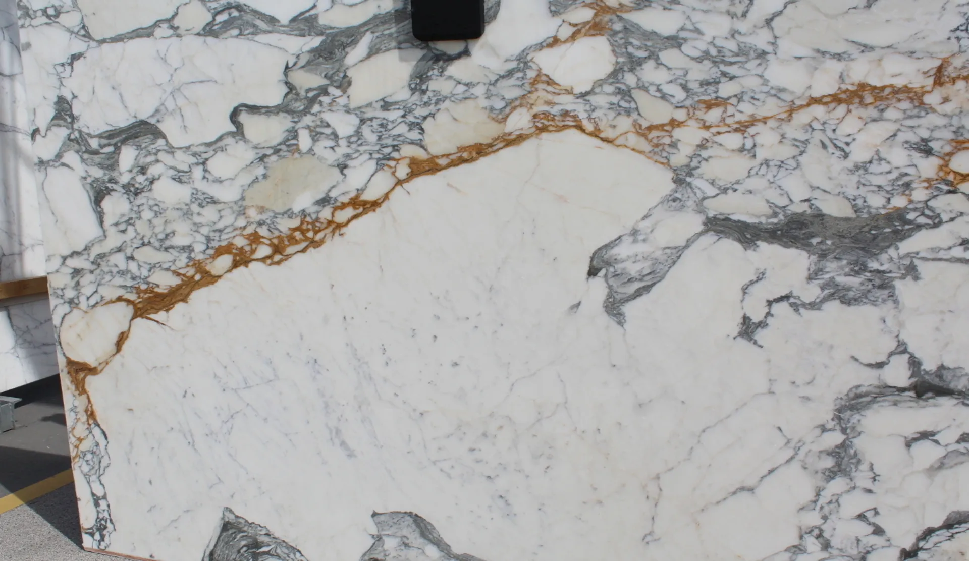 Closeup image of Paonazzo Corchia White Marble countertop slab