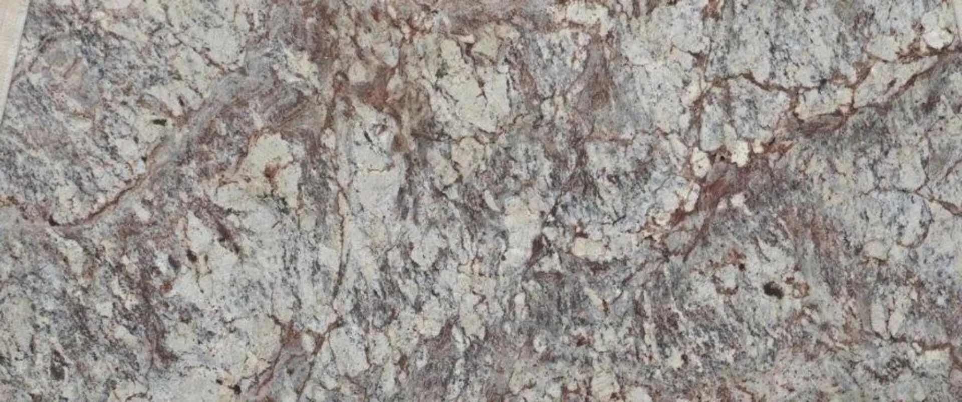 Closeup image of Typhoon Bordeaux 1st Choice Beige Granite countertop slab